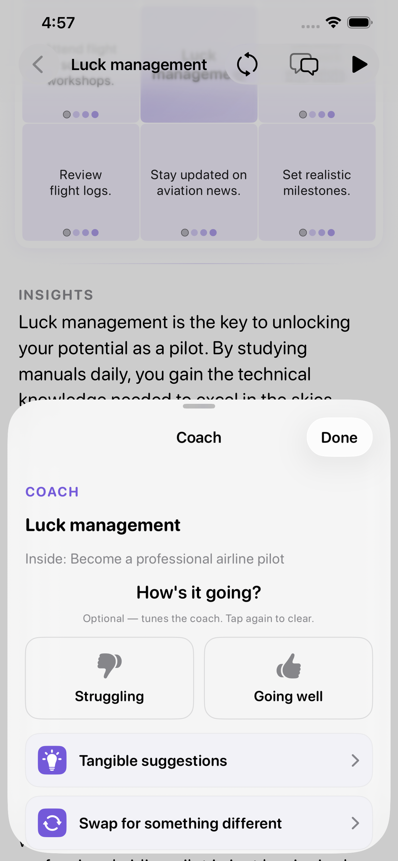 The coach on iPhone &mdash; opened on the luck management theme inside &lsquo;Become a professional airline pilot&rsquo;, asking how it is going with Struggling and Going well, and offering tangible suggestions or a swap for something different, over an insights passage about the theme