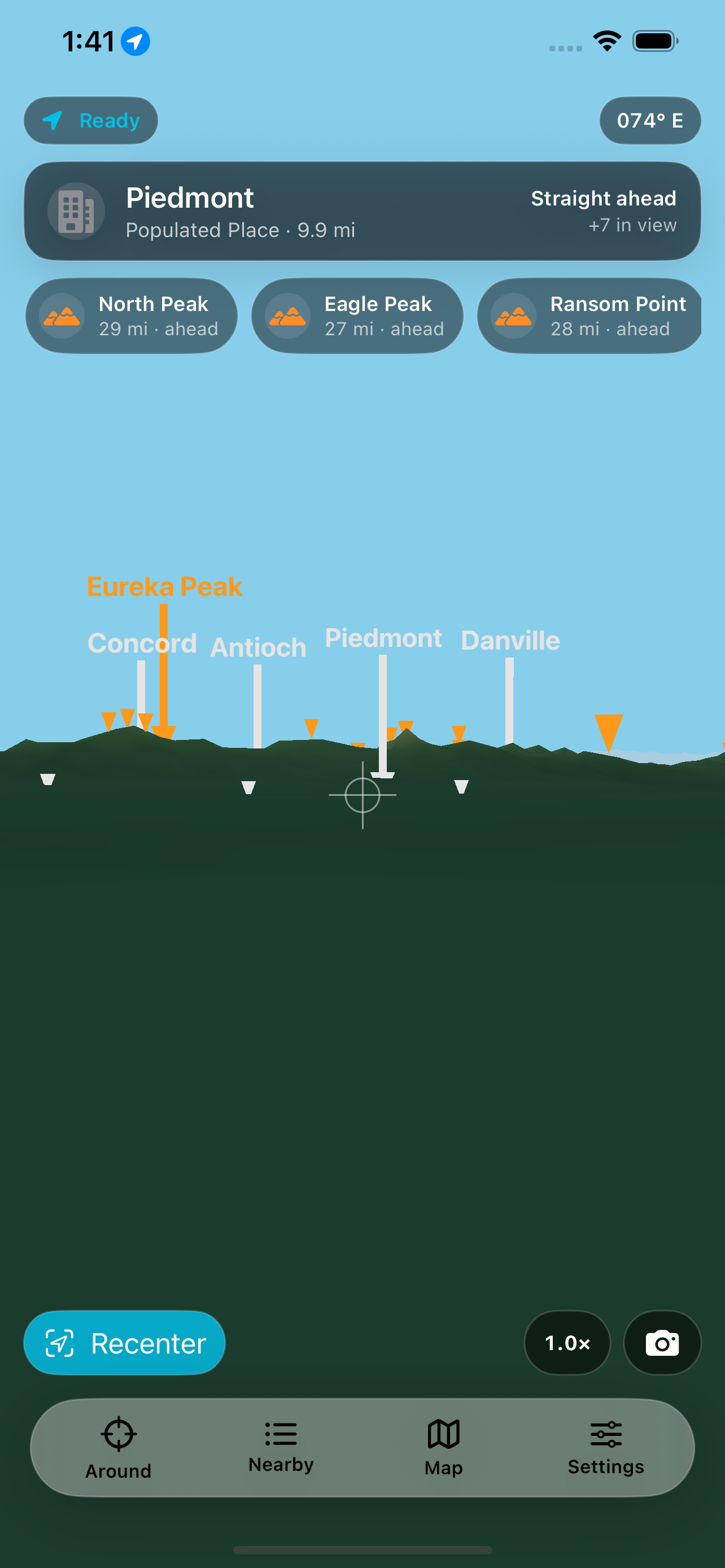 The live view on iPhone &mdash; the horizon drawn as a silhouette at bearing 074&deg; E with Concord, Antioch, Piedmont and Danville pinned along it and Eureka Peak called out in orange, a card naming Piedmont a populated place 9.9 miles straight ahead with 7 more in view, and chips for North Peak at 29 miles, Eagle Peak at 27 and Ransom Point at 28
